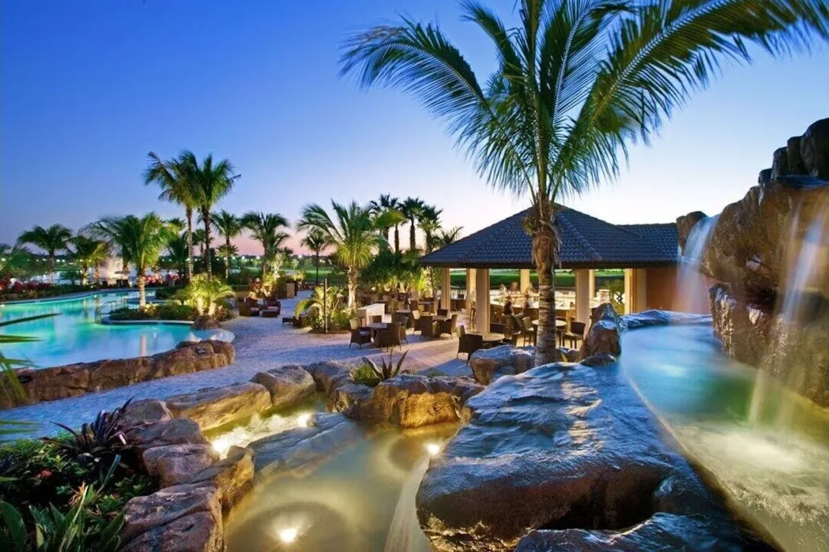 Waterfall and poolside Tiki seating at Paseo at dusk