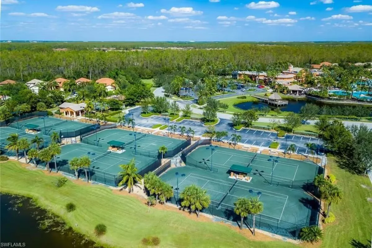 Aerial view of Paseo tennis courts beside the community lakes